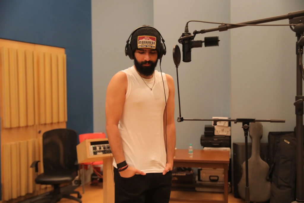 Amaal Mallik recording music in his studio